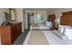 Comfortable hotel room with two beds, a dresser, and access to a kitchen area at 1200 N Ocean Blvd. N # 905, Myrtle Beach, SC 29577