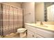 Cozy bathroom featuring a shower with a patterned curtain and a vanity with storage at 121 Olde Towne Way # 2, Myrtle Beach, SC 29588