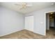 Bedroom featuring neutral-toned walls, carpet, closet, and light fixtures at 121 Olde Towne Way # 2, Myrtle Beach, SC 29588