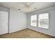 Bedroom with two windows providing natural light and fan for air circulation at 121 Olde Towne Way # 2, Myrtle Beach, SC 29588