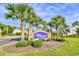 Welcome to Wellington: A beautiful community entrance with palm trees at 121 Olde Towne Way # 2, Myrtle Beach, SC 29588