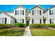 Charming two-story condo with manicured front yard and dark shutters at 121 Olde Towne Way # 2, Myrtle Beach, SC 29588