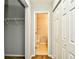 Hallway view with closet, closet organizer, and door to the bathroom at 121 Olde Towne Way # 2, Myrtle Beach, SC 29588
