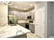 Beautiful kitchen featuring gray cabinets, stainless steel appliances, and marble countertops at 121 Olde Towne Way # 2, Myrtle Beach, SC 29588