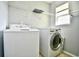 A well-lit laundry room with a modern washer and dryer at 121 Olde Towne Way # 2, Myrtle Beach, SC 29588