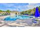 Enjoy the community pool with comfortable seating, umbrellas, and a cabana on a sunny day at 121 Olde Towne Way # 2, Myrtle Beach, SC 29588