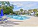 Inviting community swimming pool with ample lounge chairs, ideal for relaxation and summer fun at 121 Olde Towne Way # 2, Myrtle Beach, SC 29588