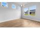 Bright dining room features wood floors, neutral walls, a modern chandelier, and multiple windows at 1226 Nw Calabash Station Blvd., Calabash, NC 28467