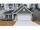 Charming single-story home featuring a two-car garage and stone veneer accents at 1226 Nw Calabash Station Blvd., Calabash, NC 28467