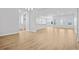 Large living room with a view of the kitchen and plank flooring at 1226 Nw Calabash Station Blvd., Calabash, NC 28467