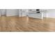 Open-concept living area with wood-look flooring and view to the kitchen at 1226 Nw Calabash Station Blvd., Calabash, NC 28467