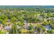 This aerial view showcases a home surrounded by mature trees and a lush green landscape, offering privacy and tranquility at 129 Old Cedar Loop, Pawleys Island, SC 29585