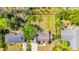 An aerial view of the home featuring a spacious backyard, mature trees, a detached shed and a perimeter fence at 129 Old Cedar Loop, Pawleys Island, SC 29585