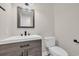 Bathroom with a single vanity with wood-grain cabinets and modern black hardware at 129 Old Cedar Loop, Pawleys Island, SC 29585