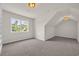 Bedroom with neutral walls, large window, carpet, and a unique ceiling at 129 Old Cedar Loop, Pawleys Island, SC 29585