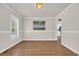 Dining room boasts wood-look floors, abundant natural light, and classic moldings at 129 Old Cedar Loop, Pawleys Island, SC 29585