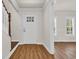 Inviting entryway with wood-look flooring and sidelight windows at 129 Old Cedar Loop, Pawleys Island, SC 29585