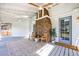 Inviting screened-in porch with outdoor seating, rug, brick fireplace, and ceiling fans at 129 Old Cedar Loop, Pawleys Island, SC 29585