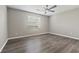 Neutral bedroom with hardwood floors, ceiling fan, and a bright window at 1406 Snowy Egret Dr., Murrells Inlet, SC 29576