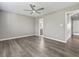 Spacious bedroom with hardwood floors and view into bathroom at 1406 Snowy Egret Dr., Murrells Inlet, SC 29576