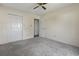 This bedroom features neutral paint, ceiling fan, carpet, and a double door closet at 1406 Snowy Egret Dr., Murrells Inlet, SC 29576