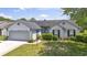 Charming single-story home features a well-maintained lawn and attached two-car garage at 1406 Snowy Egret Dr., Murrells Inlet, SC 29576