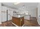 Open kitchen with white cabinets, modern appliances, and ample counter space at 1406 Snowy Egret Dr., Murrells Inlet, SC 29576