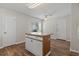 Kitchen island with storage, window, and ceiling fan at 1406 Snowy Egret Dr., Murrells Inlet, SC 29576