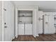 A laundry area with side by side washer and dryer tucked in closet at 1406 Snowy Egret Dr., Murrells Inlet, SC 29576