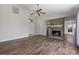 Spacious living room with vaulted ceilings, brick fireplace, and modern wood floors at 1406 Snowy Egret Dr., Murrells Inlet, SC 29576