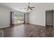 Living room featuring wood floors, a large window view and neutral color palette at 1406 Snowy Egret Dr., Murrells Inlet, SC 29576
