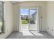 Living room with sliding glass doors providing access to the outdoor area and natural light at 1406 Snowy Egret Dr., Murrells Inlet, SC 29576