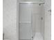 Shower features patterned wallpaper, glass enclosure, and chrome fixtures at 1406 Snowy Egret Dr., Murrells Inlet, SC 29576