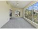 Sunroom with carpet, ceiling fan, and lots of natural light from large windows at 1406 Snowy Egret Dr., Murrells Inlet, SC 29576