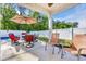 Relaxing backyard patio with patio table and chairs and a shade umbrella overlooking the yard at 146 Brittmore Park Pl., Myrtle Beach, SC 29588