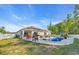 Expansive backyard featuring a sparkling pool, patio area, and manicured lawn at 146 Brittmore Park Pl., Myrtle Beach, SC 29588