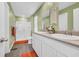 Bathroom featuring double sinks, white cabinetry, a walk-in shower, and bright accents at 146 Brittmore Park Pl., Myrtle Beach, SC 29588