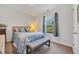 Bright bedroom featuring a plush bed with cozy blankets and a window with outside views at 146 Brittmore Park Pl., Myrtle Beach, SC 29588