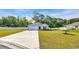 Charming single-story home with a well-manicured lawn, concrete driveway, and attached garage at 146 Brittmore Park Pl., Myrtle Beach, SC 29588