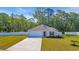 Inviting single-story home featuring a manicured lawn, concrete driveway and a convenient attached garage at 146 Brittmore Park Pl., Myrtle Beach, SC 29588