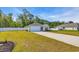 Charming single-story home with well-kept lawn and a concrete driveway leading to the attached garage at 146 Brittmore Park Pl., Myrtle Beach, SC 29588