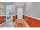 Hallway featuring wood-look floors and a decorative rug, leading to a bedroom and other living areas at 146 Brittmore Park Pl., Myrtle Beach, SC 29588