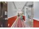 Inviting hallway with wood-look floors, neutral walls, and decorative accents, leading to other rooms at 146 Brittmore Park Pl., Myrtle Beach, SC 29588