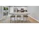 Kitchen island with granite countertops and barstool seating; stainless steel appliances, plus a patio door at 146 Brittmore Park Pl., Myrtle Beach, SC 29588