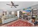 Spacious living room with a modern fireplace, entertainment center, and comfortable seating at 146 Brittmore Park Pl., Myrtle Beach, SC 29588