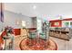 Comfortable dining area adjacent to the living space, featuring a glass table and unique chairs at 146 Brittmore Park Pl., Myrtle Beach, SC 29588