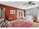 Cozy living room featuring a red accent wall, plush red rug, and comfortable cream colored seating at 146 Brittmore Park Pl., Myrtle Beach, SC 29588