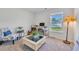 Bright home office with a large window, desk, and a cozy chair for productive work at 146 Brittmore Park Pl., Myrtle Beach, SC 29588