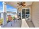 Covered patio with a ceiling fan and outside seating, leading to a private fenced in backyard at 146 Brittmore Park Pl., Myrtle Beach, SC 29588