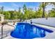 Beautiful backyard pool area with a manicured lawn and well-maintained landscaping at 146 Brittmore Park Pl., Myrtle Beach, SC 29588